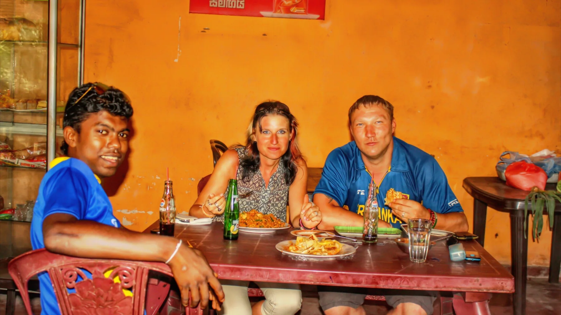 Travellers enjoying local food in Sri Lanka