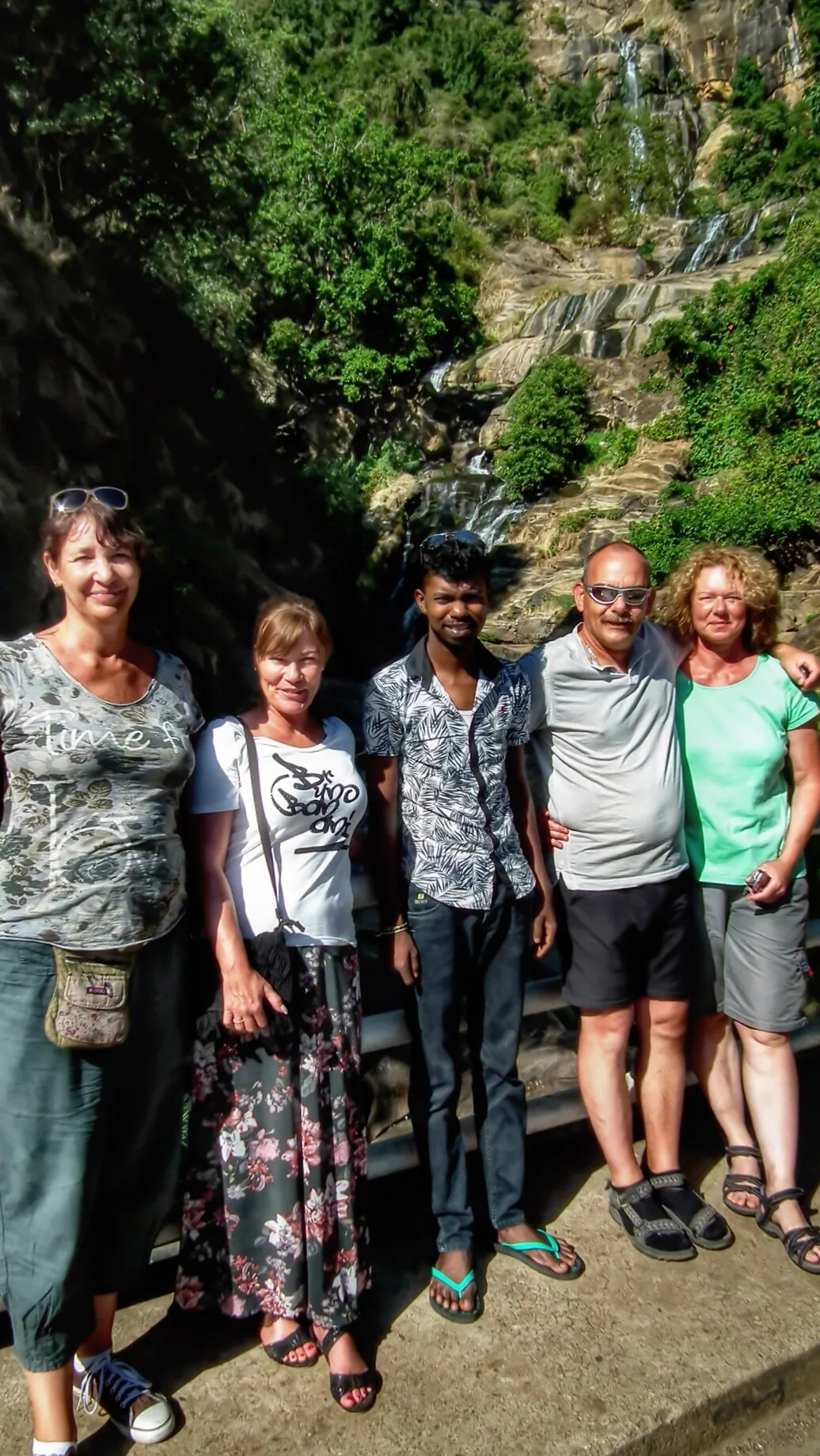 Travellers at a Sri Lanka waterfall